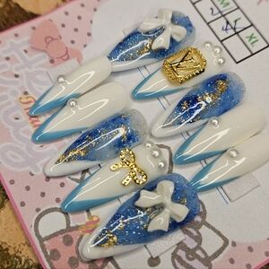 Blue and White Nail Art with Gold Accents